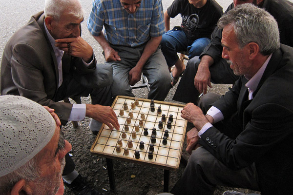 Men playing Turkish draughts